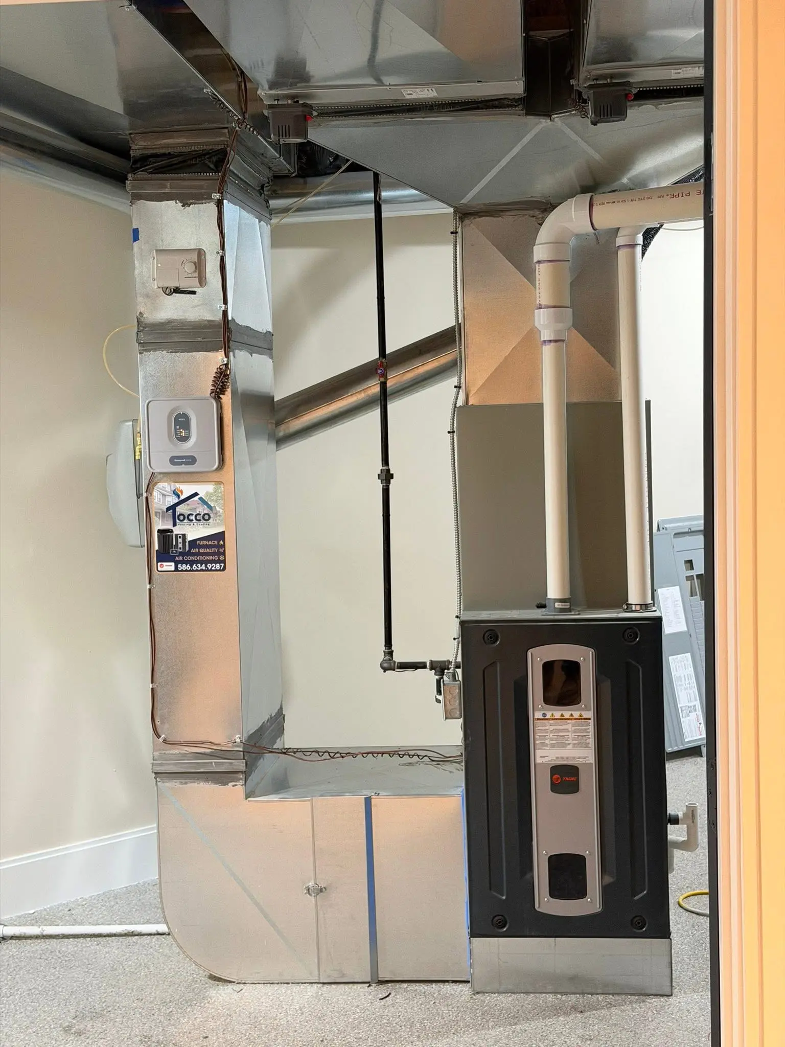 Residential furnace and ductwork in utility room