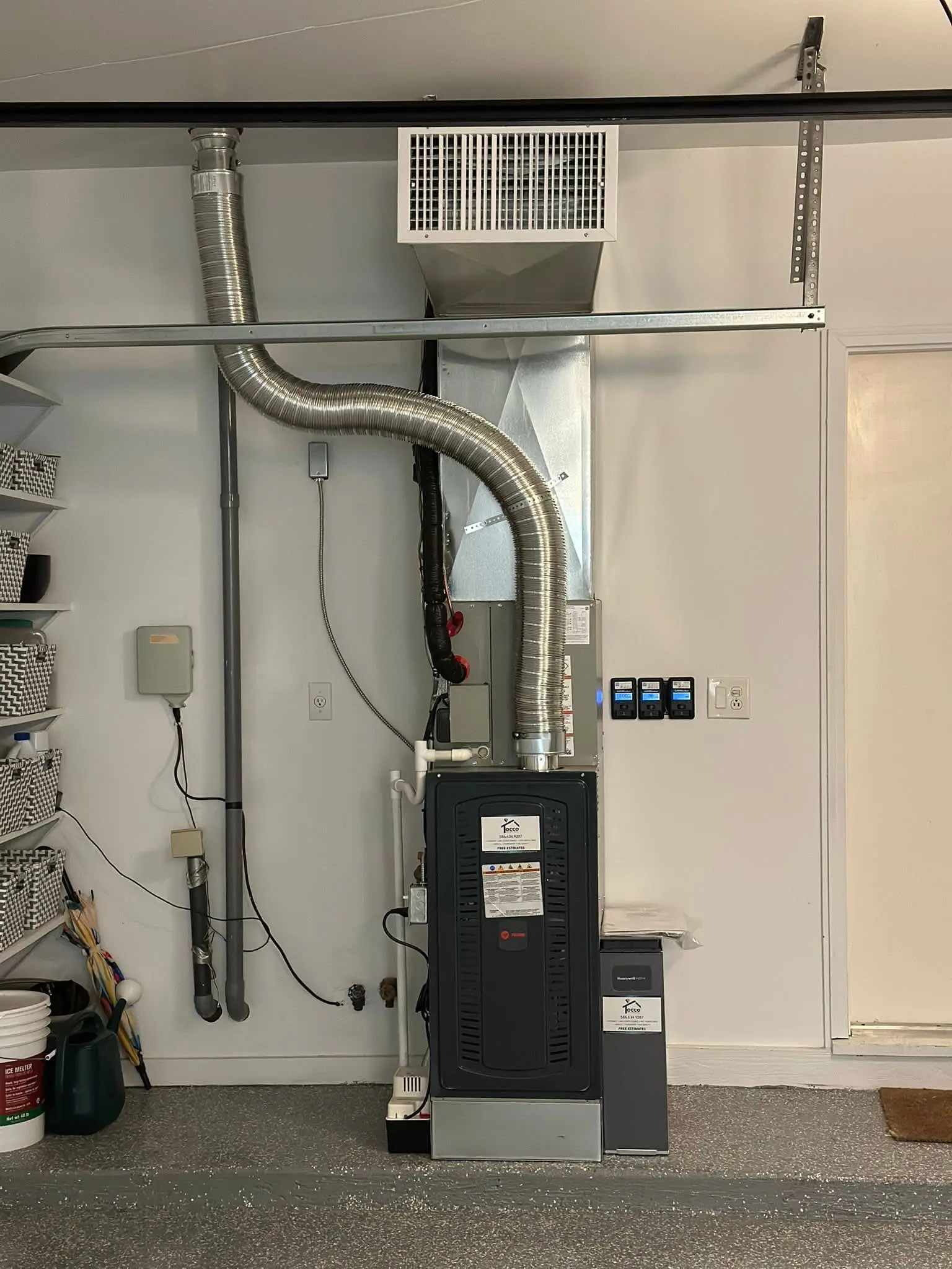 Furnace and ventilation ducts in garage