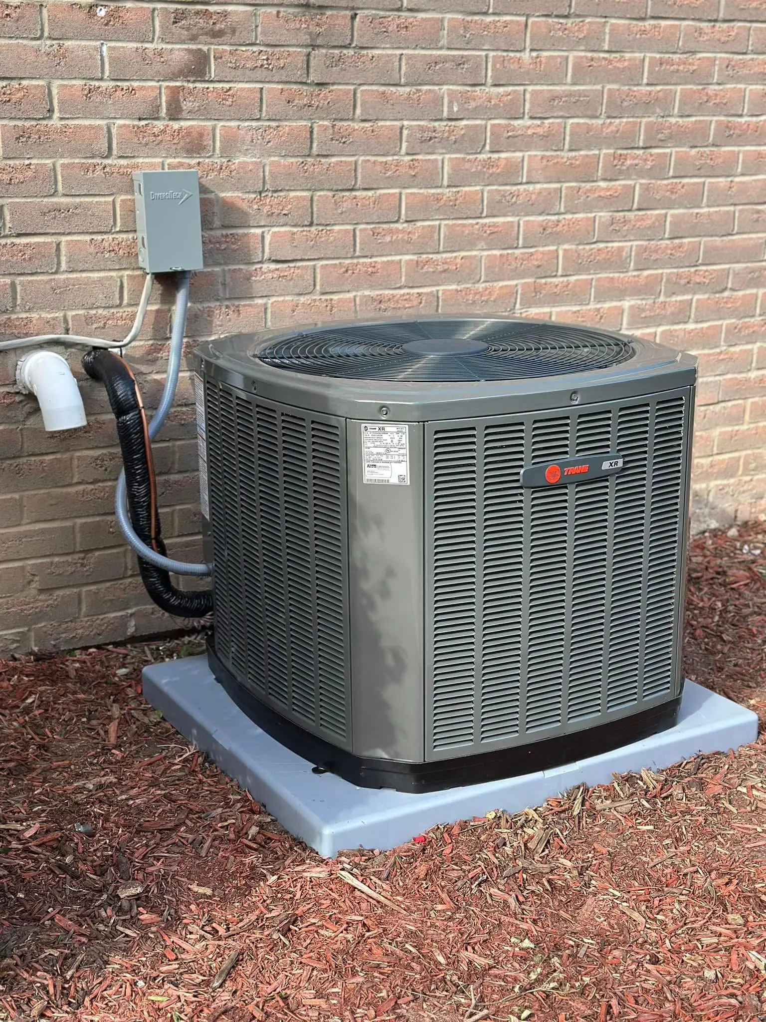 Outdoor air conditioning unit on concrete pad